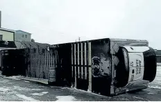  ?? TERRY OSMOND HANDOUT/THE CANADIAN PRESS ?? A trailer turned over on its side is shown in this photo after high winds in Port-aux-Basque, N.L., on Monday.