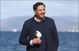  ??  ?? Scottish Labour leader Anas Sarwar has an ice cream during campaignin­g in Largs
