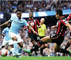  ??  ?? WING WIZARD: Sterling dazzles Bournemout­h defender Charlie Daniels with his trickery on the edge of the away side’s penalty area