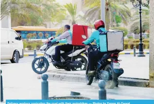  ?? ?? Delivery workers navigating the road with their motorbikes — Photos by Yasser Al-Zayyat