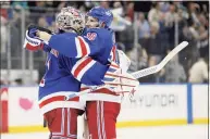  ?? Brad Penner / Getty Images ?? The Rangers’ Igor Shesterkin, left, and Ryan Strome celebrate after beating the Kings on Monday at Madison Square Garden in New York.