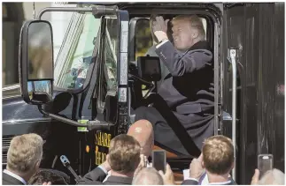  ?? AP PHOTO ?? SOUNDING OFF: President Trump honks the horn of a big rig parked outside the White House yesterday.