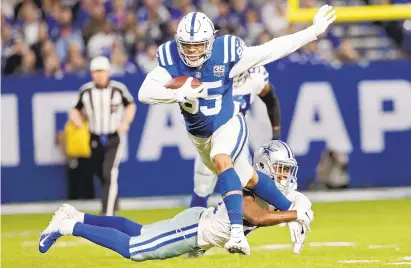  ?? AJ MAST/ASSOCIATED PRESS FILE ?? Colts tight end Eric Ebron, one of Andrew Luck’s many targets, runs out of a tackle by Dallas’ Chidobe Awuzie in December.