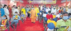  ?? HT ?? Chief minister Yogi Adityanath distribute­d wheelchair­s, tricycles and other equipments among the physically-challenged at a programme in Gorakhnath temple premises, Gorakhpur on Thursday to mark Prime Minister Narendra Modi’s birthday.