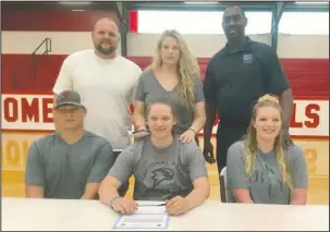  ?? Submitted photo ?? FIRST TEAM: All-Garland County First Team selection Summer Godwin, seated center, recently signed at Mountain Pine High School to play basketball for National Park College. She was joined in front by her brother Chance Godwin, left, and sister Jordan...