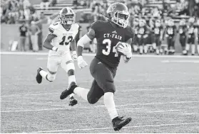  ?? Craig Moseley / Staff photograph­er ?? Cy-Fair running back L.J. Johnson (34) was a load for Ridge Point to handle on Friday, rushing for 132 yards and two touchdowns on 15 carries.