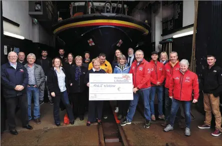  ??  ?? Brian Nolan, Gus Cooney, Colm O Neill, Eoin Gaffney and Mary Aldridge presenting the cheque to members of Wicklow RNLI crew.