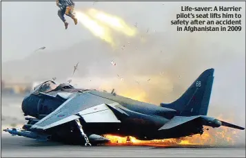  ??  ?? Life-saver: A Harrier pilot’s seat lifts him to safety after an accident in Afghanista­n in 2009