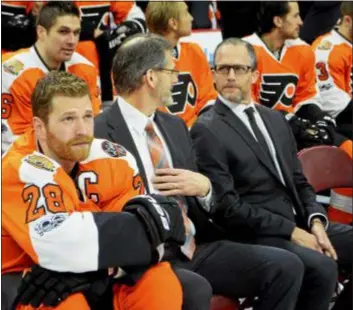  ?? SUBMITTED PHOTO — ZACK HILL ?? Flyers’ front office veteran Chris Pryor, sitting as ex-GM Ron Hextall’s left-hand man on Team Picture Day four years ago, was let go by the club Wednesday along with assistant coach Gord Murphy.