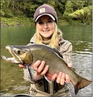  ?? (Photo courtesy Arkansas Game and Fish Commission) ?? Megan Gray caught this giant brook trout, possibly a state-record, in the catch-and-release area of the Little Red River.