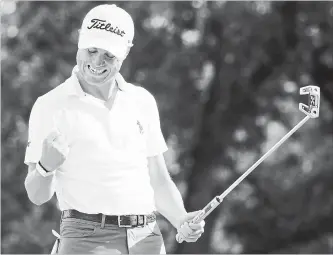  ?? GETTY IMAGES FILE PHOTO ?? Justin Thomas of the United States celebrates on the 18th green after winning the BMW Championsh­ip golf tournament in Medinah, Ill., on Sunday. He will start at East Lake with a two-stroke lead.