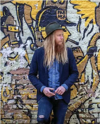  ??  ?? PERPETUAL TOURER: Toowoomba-raised musician Stu Larsen lives out of a suitcase these days as he tours the world.