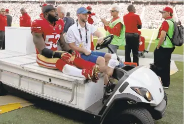  ?? NHAT V. MEYER/STAFF ?? NaVorro Bowman is carted off the field after being injured in the third quarter of Sunday’s game against the Cowboys.