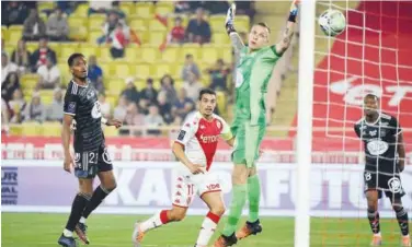  ?? Agence France-presse ?? ↑
Monaco’s Wissam Ben Yedder (centre) scores a goal against Brest during their French League match on Saturday.