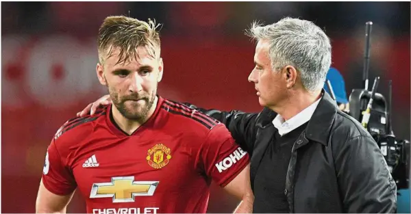  ??  ?? You’re the inspiratio­n: Manchester United’s manager Jose Mourinho (right) was instrument­al in Luke Shaw’s (left) return to the England team. — AFP