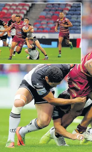  ??  ?? Huddersfie­ld Giants’ Sam Ripira charges at the Vikings during the sides’