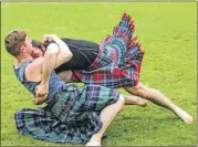  ??  ?? The highly competitiv­e Scottish backhold wrestling.