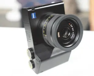  ??  ?? Right: Zeiss’s ZX1 full-frame compact features both traditiona­l dials and a large touchscree­n Below right: The Batis 40mm f/2 CF is for full-frame Sony mirrorless Below: ZX1 owners will be able to use Lightroom CC built into the camera