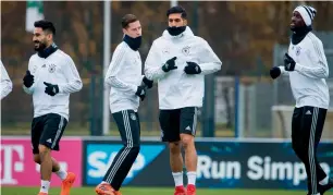  ?? AFP ?? (Left to right) German players Ilkay Guendogan, Julian Draxler, Emre Can and Antonio Ruediger take part in a training session. —