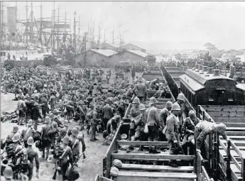  ??  ?? Anglo-boer War 1899-1902: British soldiers are offloaded in Table Bay harbour for transfer to trains that will take them to the warfront. Colonial forces poured into South Africa in the 1800s. The Cecil John Rhodes statue, a symbol of colonialis­m, at...