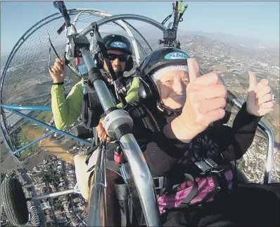  ?? PICTURE: PDSA/PA WIRE. ?? THUMBS UP: Connie Smith takes in the view as she goes paraglidin­g in southern Spain.