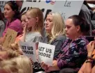  ?? RICK BOWMER/AP FILE ?? Residents wait for the Salt Lake County Council to vote to overturn a mask mandate for students through sixth grade.