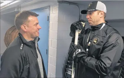  ?? BRENDAN MCCARTHY/THE TELEGRAM ?? Newfoundla­nd Growlers head coach Ryan Clowe (right) talks to Trevor Murphy, the ECHL team’s director of hockey operations, after a Tuesday practice at the Glacier in Mount Pearl.