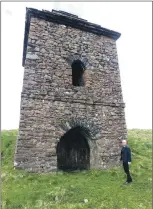  ?? ?? Fellow walker Alastair Gray takes a well-earned rest at the 18th century watchtower.