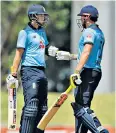  ??  ?? Happy days: Joe Root (left) congratula­tes Jonny Bairstow on reaching his century