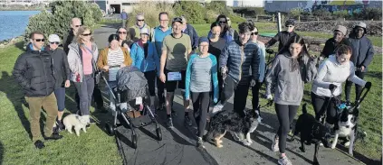  ?? PHOTO: GERARD O’BRIEN ?? Fundraisin­g fun . . . Supporters of Dunedin Hospital intensive care nurse Teresa Sevilla participat­e in the running leg of a triathlon, which raised about $3000 for her family.