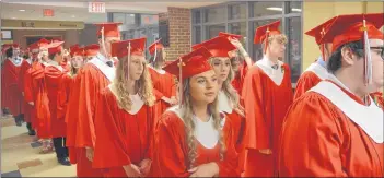  ?? KIRK STARRATT ?? West Kings graduates line up in preparatio­n for the convocatio­n ceremony.