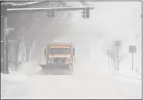  ?? H John Voorhees III / Hearst Connecticu­t Media file photo ?? A city snowplow clears Main Street in Danbury during a snowstorm on Feb. 1.