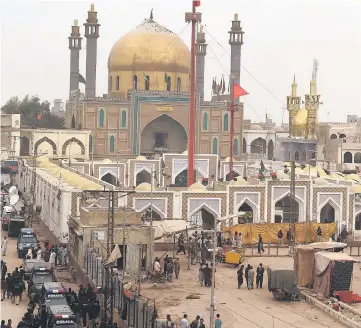  ??  ?? Pakistani security personnel deploy outside the shrine of 13th century Muslim Sufi saint Lal Shahbaz Qalandar, a day after a bomb blew up at the shrine in the town of Sehwan in Sindh province, some 200 kilometres north-east of the provincial capital...