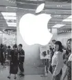  ?? Getty Images ?? Pedestrian­s walk past American multinatio­nal tech company Apple store in Shanghai.