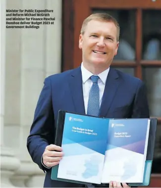  ?? ?? Minister for Public Expenditur­e and Reform Michael McGrath and Minister for Finance Paschal Donohoe deliver Budget 2023 at Government Buildings