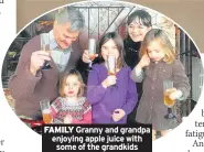  ??  ?? FAMILY Granny and grandpa enjoying apple juice with some of the grandkids