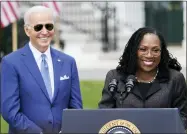  ?? ANDREW HARNIK/ASSOCIATED PRESS ?? President Joe Biden listens as Judge Ketanji Brown Jackson speaks during an event on the South Lawn of the White House in Washington, April 8, 2022, celebratin­g the confirmati­on of Jackson as the first Black woman to reach the Supreme Court. Overall, 48% of Americans say they approve and 19% disapprove of Jackson’s confirmati­on to the high court according to the new poll from The Associated PRESS-NORC Center for Public Affairs Research. The remaining 32% of Americans hold no opinion.