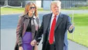  ?? REUTERS ?? US President Donald Trump talks to reporters with first lady Melania Trump as they depart for travel to the G20 summit.