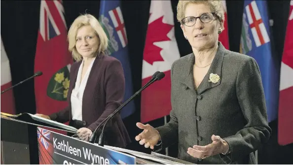  ?? CHRIS YOUNG/THE CANADIAN PRESS ?? Premier Rachel Notley and Ontario Premier Kathleen Wynne hold a news conference in Toronto Friday. Wynne praised Notley’s climate change plans and said Ontario’s conditions for supporting the Energy East pipeline project are “starting to be addressed.”