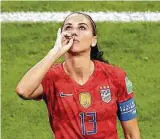  ?? Maja Hitij / Getty Images ?? Alex Morgan celebrates her go-ahead goal for the Americans by mimicking that she’s taking a sip of tea.