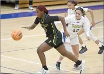  ?? JOEL ROSENBAUM / THE REPORTER ?? Vanden High’s Alyssa Jackson (0) drives the ball past Will C. Wood High’s Lucia Alexander (12) during their game in January. Both teams qualified for the Sac-Joaquin Section Championsh­ips.