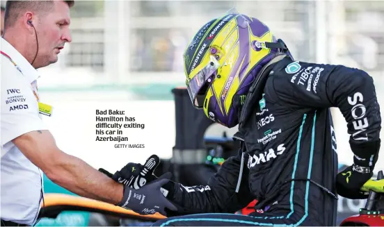  ?? GETTY IMAGES ?? Bad Baku: Hamilton has difficulty exiting his car in Azerbaijan