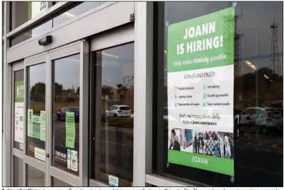  ?? (AP/John Raoux) ?? A sign advertises job openings Tuesday at a Joann fabric and craft store in Orlando, Fla. The number of people seeking unemployme­nt aid rose last week by the most since late August.