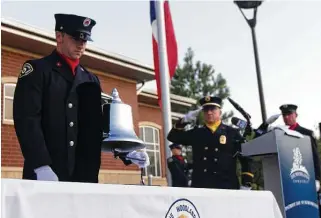  ?? Jason Fochtman / Staff file photo ?? A member of The Woodlands Firefighte­r Honor Guard rings a bell in remembranc­e of the nearly 3,000 victims of the terror attacks on 9/11 during a 2019 ceremony.
