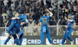  ?? PTI ?? Mumbai Indians players celebrate after winning the 51st T20 cricket match of the Indian Premier League 2022 (IPL season 15), between the Gujarat Titans and the Mumbai Indians, at Brabourne Stadium (CCI) in Mumbai, Friday