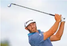  ?? AP PHOTO BY ANDY CLAYTON-KING ?? Dustin Johnson tees off on the fourth hole at TPC Twin Cities during the first round of the PGA Tour’s 3M Open on Thursday in Blaine, Minn. Johnson shot a 78 and withdrew, citing a back injury.