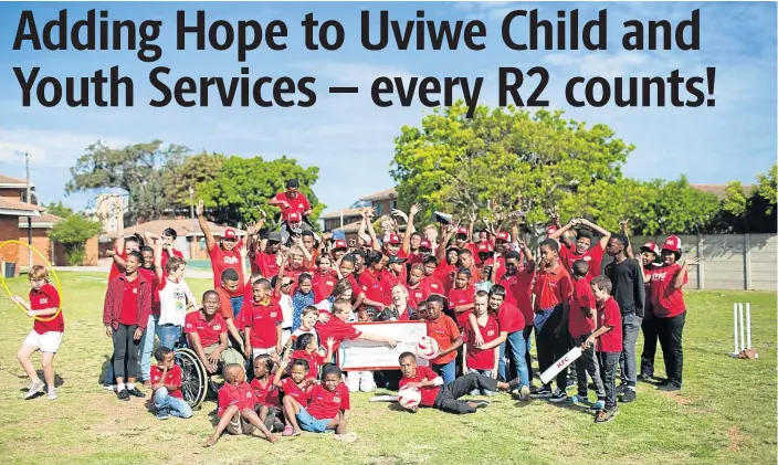  ??  ?? ALL SMILES: KFC staff and children from the Eastern Province Child and Youth Care Centre celebrate the handover of a cheque to the value of R103,000, which will assist with supplying nutritious meals to the children at the centre