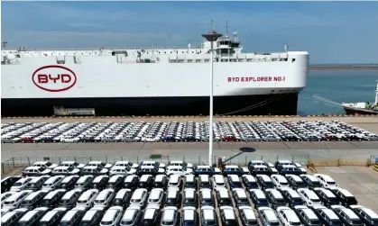  ?? ?? BYD electric vehicles parked up before being loaded for export at Lianyungan­g port, Jiangsu province. Photograph: China Daily/Reuters