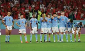  ?? ?? Spain players watch the shootout defeat by Morocco. Photograph: Tom Jenkins/The Guardian