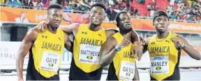  ?? PHOTOS BY GLADSTONE TAYLOR/PHOTOGRAPH­ER ?? Jamaica’s men’s 4x400m team of (from left) Demish Gaye, Peter Matthews, Steven Gayle and Martin Manley pose for the cameras after their IAAF World Relay bronze medal run.